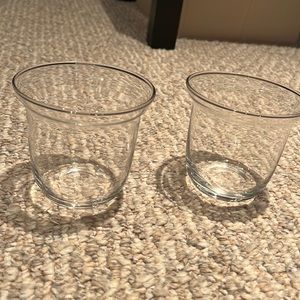 Two glass candle holders